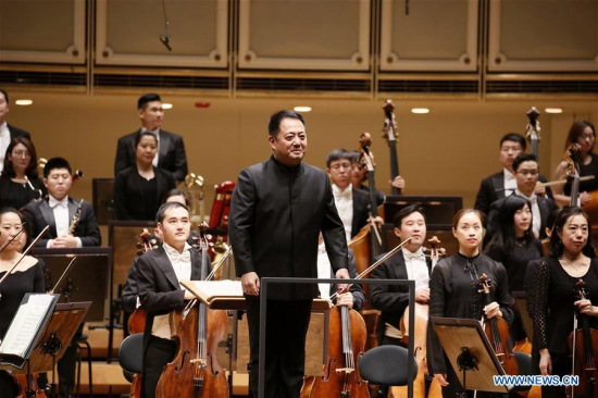 Lu Jia, music director and chief conductor of the Performing Arts (NCPA) Orchestra greets the audience at the Symphony Center in Chicago, the United States, Oct. 28, 2017. A sold-out concert performed here Saturday by China NCPA Orchestra caught the attention of the whole audience by showcasing a unique combination of Western and Chinese music.(Xinhua/Wang Ping) Lu Jia, music director and chief conductor of the Performing Arts (NCPA) Orchestra greets the audience at the Symphony Center in Chicago, the United States, Oct. 28, 2017. A sold-out concert performed here Saturday by China NCPA Orchestra caught the attention of the whole audience by showcasing a unique combination of Western and Chinese music.(Xinhua/Wang Ping)