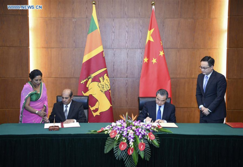 Chinese Foreign Minister Wang Yi holds talks with visiting Sri Lankan Foreign Minister Tilak Marapana in Beijing, capital of China, Oct. 30, 2017. After the meeting, the two sides exchanged letters of approval for a mutual legal assistance treaty. (Xinhua/Zhang Ling) Chinese Foreign Minister Wang Yi holds talks with visiting Sri Lankan Foreign Minister Tilak Marapana in Beijing, capital of China, Oct. 30, 2017. After the meeting, the two sides exchanged letters of approval for a mutual legal assistance treaty. (Xinhua/Zhang Ling)