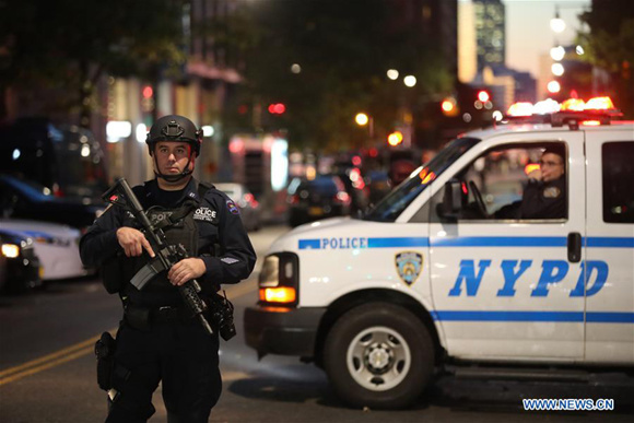Police officers stand guard near the site of an attack in lower Manhattan in New York, the United States, on Oct. 31, 2017. Eight people were killed and a dozen more injured after a truck plowed into pedestrians near the World Trade Center in New York City, the mayor said on Tuesday. (Xinhua/Wang Ying) Police officers stand guard near the site of an attack in lower Manhattan in New York, the United States, on Oct. 31, 2017. Eight people were killed and a dozen more injured after a truck plowed into pedestrians near the World Trade Center in New York City, the mayor said on Tuesday. (Xinhua/Wang Ying)