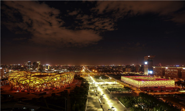 A night shot of the Beijing National Stadium, or the Bird's Nest, and Beijing National Aquatics Center, or Water Cube. (Photo/Xinhua) A night shot of the Beijing National Stadium, or the Bird's Nest, and Beijing National Aquatics Center, or Water Cube. (Photo/Xinhua)