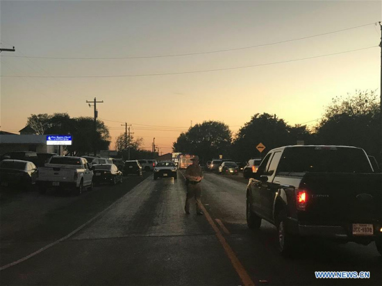 A road near the attack site is blocked by police in Sutherland Springs of Texas, the United States, Nov. 5, 2017. Twenty-six people were shot dead when a gunman opened fire at a church during Sunday services in Sutherland Springs, Texas Governor Greg Abbott said on Sunday. (Xinhua/Liu Liwei) A road near the attack site is blocked by police in Sutherland Springs of Texas, the United States, Nov. 5, 2017. Twenty-six people were shot dead when a gunman opened fire at a church during Sunday services in Sutherland Springs, Texas Governor Greg Abbott said on Sunday. (Xinhua/Liu Liwei)