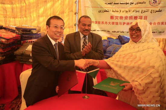 Chinese Ambassador to Sudan Li Lianhe (L) attends a signing ceremony in Khartoum, Sudan, Nov. 5, 2017. The Chinese Embassy in Khartoum on Sunday launched a joint project with a local non-governmental organization (NGO) for distributing shelter materials to about 1,000 families affected by recent rains and floods in Sudan. (Xinhua/Mohamed Khidi) Chinese Ambassador to Sudan Li Lianhe (L) attends a signing ceremony in Khartoum, Sudan, Nov. 5, 2017. The Chinese Embassy in Khartoum on Sunday launched a joint project with a local non-governmental organization (NGO) for distributing shelter materials to about 1,000 families affected by recent rains and floods in Sudan. (Xinhua/Mohamed Khidi)