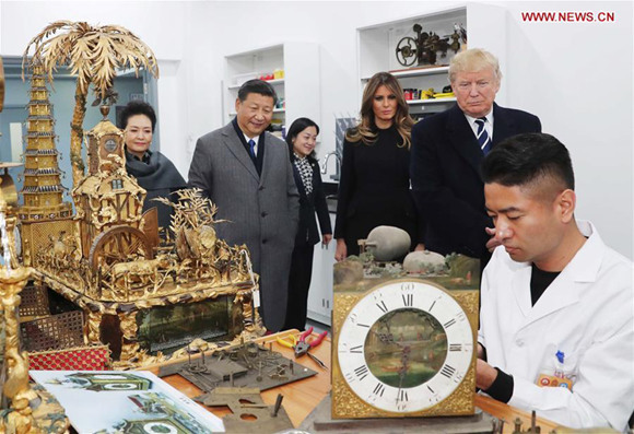 Chinese President Xi Jinping (2nd L) and his wife Peng Liyuan (1st L), and U.S. President Donald Trump (2nd R) and his wife Melania Trump (3rd R) watch the repair of some historical relics at the conservation workshop of the Palace Museum in Beijing, capital of China, Nov. 8, 2017. (Xinhua/Liu Weibing) Chinese President Xi Jinping (2nd L) and his wife Peng Liyuan (1st L), and U.S. President Donald Trump (2nd R) and his wife Melania Trump (3rd R) watch the repair of some historical relics at the conservation workshop of the Palace Museum in Beijing, capital of China, Nov. 8, 2017. (Xinhua/Liu Weibing)