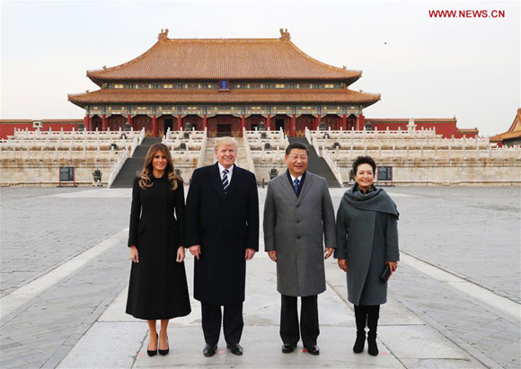 President Xi Jinping and his wife, Peng Liyuan, and U.S. President Donald Trump and his wife, Melania Trump, pose for a photo in front of the Hall of Supreme Harmony during their visit to the Palace Museum, or the Forbidden City, in Beijing on Wednesday. (Photo: Xinhua/Lan Hongguang) President Xi Jinping and his wife, Peng Liyuan, and U.S. President Donald Trump and his wife, Melania Trump, pose for a photo in front of the Hall of Supreme Harmony during their visit to the Palace Museum, or the Forbidden City, in Beijing on Wednesday. (Photo: Xinhua/Lan Hongguang)