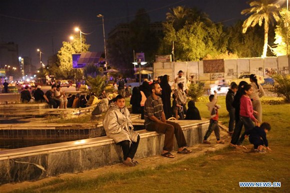 People gather outdoor in Baghdad, Iraq, on Nov. 12, 2017. (Xinhua/Khalil Dawood) People gather outdoor in Baghdad, Iraq, on Nov. 12, 2017. (Xinhua/Khalil Dawood)