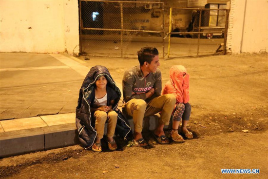 People gather outdoor in Baghdad, Iraq, on Nov. 12, 2017. A huge earthquake measuring 7.2 magnitude hit Iraq's northern province of Sulaimaniyah on Sunday, killing four people and injuring 50 others, according to the Kurdish Rudaw newsite. (Xinhua/Khalil Dawood) People gather outdoor in Baghdad, Iraq, on Nov. 12, 2017. A huge earthquake measuring 7.2 magnitude hit Iraq's northern province of Sulaimaniyah on Sunday, killing four people and injuring 50 others, according to the Kurdish Rudaw newsite. (Xinhua/Khalil Dawood)