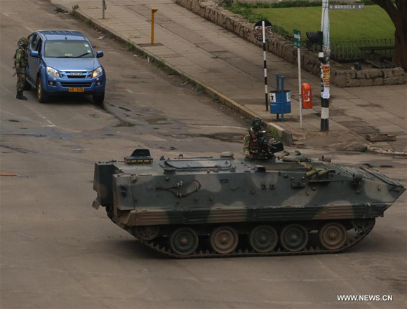 Soldiers and an armored vehicle patrol on a street in Harare, capital of Zimbabwe, Nov. 15, 2017. (Xinhua/Philimon Bulawayo) Soldiers and an armored vehicle patrol on a street in Harare, capital of Zimbabwe, Nov. 15, 2017. (Xinhua/Philimon Bulawayo)