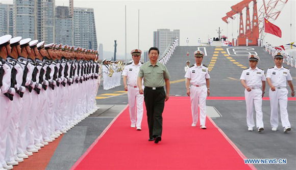 Xi Jinping reviews an honor guard on the aircraft carrier, the Liaoning, in northeast China's Liaoning Province, Aug. 28, 2013. (Xinhua/Li Gang) Xi Jinping reviews an honor guard on the aircraft carrier, the Liaoning, in northeast China's Liaoning Province, Aug. 28, 2013. (Xinhua/Li Gang)