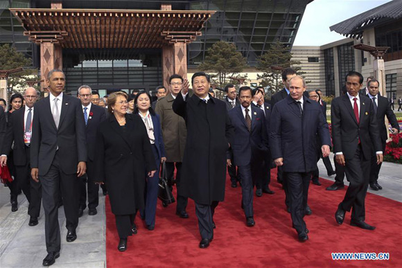 Xi Jinping and other leaders and representatives from the Asia-Pacific Economic Cooperation (APEC) walk to plant trees to mark friendship in the APEC family in Beijing, capital of China, Nov. 11, 2014. (Xinhua/Lan Hongguang) Xi Jinping and other leaders and representatives from the Asia-Pacific Economic Cooperation (APEC) walk to plant trees to mark friendship in the APEC family in Beijing, capital of China, Nov. 11, 2014. (Xinhua/Lan Hongguang)