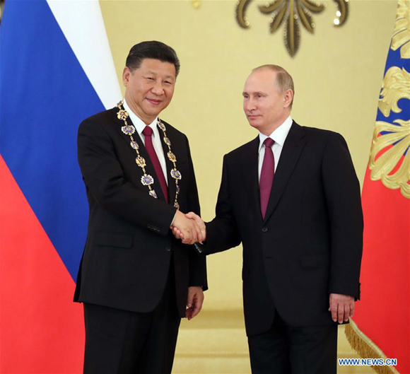 Xi Jinping is awarded by his Russian counterpart Vladimir Putin the highest order of Russia, or the Order of St. Andrew the Apostle the First-Called, after their talks in Moscow, Russia, July 4, 2017. (Xinhua/Liu Weibing) Xi Jinping is awarded by his Russian counterpart Vladimir Putin the highest order of Russia, or the Order of St. Andrew the Apostle the First-Called, after their talks in Moscow, Russia, July 4, 2017. (Xinhua/Liu Weibing)
