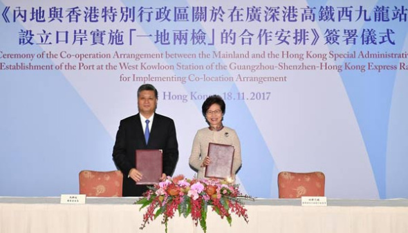 Guangdong governor Ma Xingrui (left) and Chief Executive of Hong Kong SAR Carrie Lam Cheng Yuet-ngor pose for photos after signing a deal of Co-operation Arrangement Between the Mainland and the Hong Kong Special Administrative Region on the Establishment of the Port at the West Kowloon Station of the Guangzhou-Shenzhen-Hong Kong Express Rail Link for Implementing Co-location Arrangement in Hong Kong, November 18, 2017. (Photo/Xinhua) Guangdong governor Ma Xingrui (left) and Chief Executive of Hong Kong SAR Carrie Lam Cheng Yuet-ngor pose for photos after signing a deal of Co-operation Arrangement Between the Mainland and the Hong Kong Special Administrative Region on the Establishment of the Port at the West Kowloon Station of the Guangzhou-Shenzhen-Hong Kong Express Rail Link for Implementing Co-location Arrangement in Hong Kong, November 18, 2017. (Photo/Xinhua)