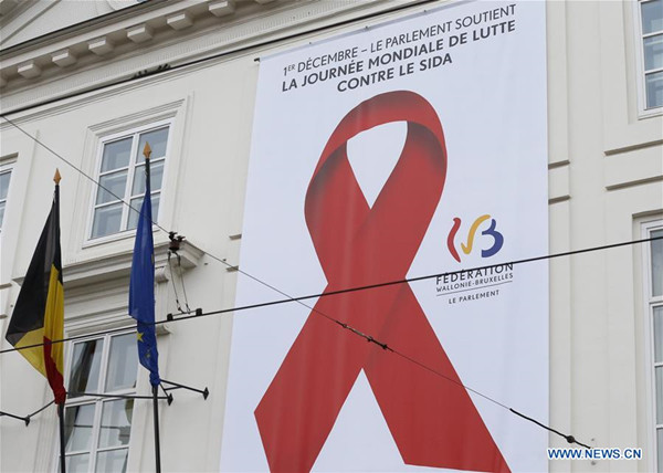 Photo taken on Dec. 1, 2017 shows a poster with red ribbon logo on the exterior wall of a government building in downtown Brussels, Belgium, on the occasion of World Aids Day. (Xinhua/Ye Pingfan) Photo taken on Dec. 1, 2017 shows a poster with red ribbon logo on the exterior wall of a government building in downtown Brussels, Belgium, on the occasion of World Aids Day. (Xinhua/Ye Pingfan)