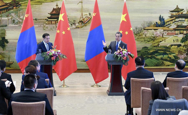 Chinese Foreign Minister Wang Yi (R back) and visiting Mongolian Foreign Minister Damdin Tsogtbaatar meet the press after their talks in Beijing, capital of China, Dec. 4, 2017. (Xinhua/Zhang Ling) Chinese Foreign Minister Wang Yi (R back) and visiting Mongolian Foreign Minister Damdin Tsogtbaatar meet the press after their talks in Beijing, capital of China, Dec. 4, 2017. (Xinhua/Zhang Ling)