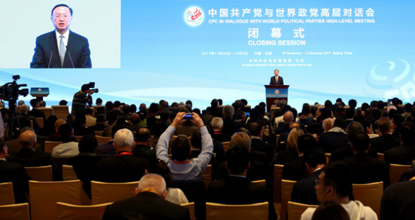 State Councilor Yang Jiechi, a member of the CPC Central Committee Political Bureau, addresses delegates to an international seminar in Beijing at its closing session on Sunday. FENG YONGBIN/CHINA DAILY State Councilor Yang Jiechi, a member of the CPC Central Committee Political Bureau, addresses delegates to an international seminar in Beijing at its closing session on Sunday. FENG YONGBIN/CHINA DAILY