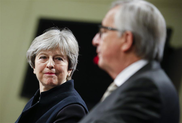 British Prime Minister Theresa May (L) and European Commission President Jean-Claude Juncker attend a press conference after their meeting on Brexit at EU headquarters in Brussels, Belgium, on Dec. 4, 2017. Despite continuous efforts and growing common grounds of Britain and the European Union, it was not possible to reach a complete agreement Monday, said Jean-Claude Juncker in a hastily arranged press conference with visiting British Prime Minister Theresa May. (Xinhua/Ye Pingfan) British Prime Minister Theresa May (L) and European Commission President Jean-Claude Juncker attend a press conference after their meeting on Brexit at EU headquarters in Brussels, Belgium, on Dec. 4, 2017. Despite continuous efforts and growing common grounds of Britain and the European Union, it was not possible to reach a complete agreement Monday, said Jean-Claude Juncker in a hastily arranged press conference with visiting British Prime Minister Theresa May. (Xinhua/Ye Pingfan)