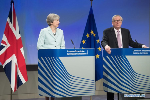 European Commission President Jean-Claude Juncker (R) and British Prime Minister Theresa May attend a joint press conference in Brussels, Belgium, Dec. 8, 2017. The European Commission has found sufficient progress in the first phase of the Brexit talks and will recommend to the European Council to open the second phase, European Commission President Jean-Claude Juncker said Friday. (Xinhua/The European Union) European Commission President Jean-Claude Juncker (R) and British Prime Minister Theresa May attend a joint press conference in Brussels, Belgium, Dec. 8, 2017. The European Commission has found sufficient progress in the first phase of the Brexit talks and will recommend to the European Council to open the second phase, European Commission President Jean-Claude Juncker said Friday. (Xinhua/The European Union)