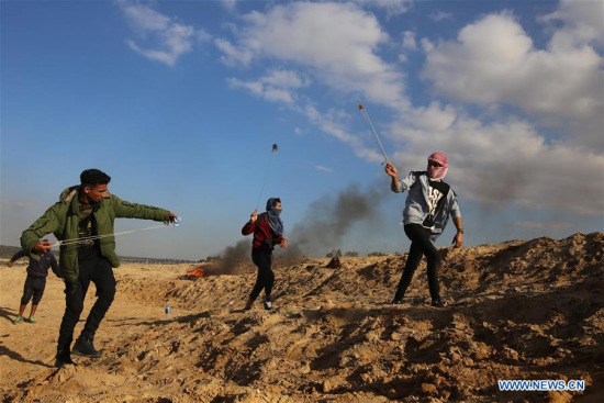 Palestinian protesters hurl stones at Israeli troops during clashes after a protest against U.S. recognition of Jerusalem as Israeli capital, in Khan Younis, southern Gaza Strip, on Dec. 8, 2017. (Xinhua/Khaled Omar) Palestinian protesters hurl stones at Israeli troops during clashes after a protest against U.S. recognition of Jerusalem as Israeli capital, in Khan Younis, southern Gaza Strip, on Dec. 8, 2017. (Xinhua/Khaled Omar)