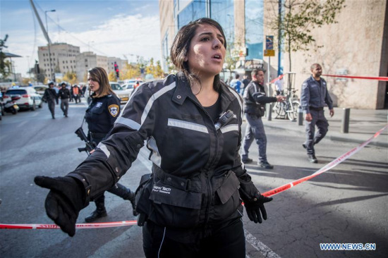 Israeli police guard the site of a knife attack at Jerusalem's central bus station, on Dec. 10, 2017. An Israeli security guard was seriously wounded Sunday by a Palestinian knifeman outside Jerusalem's central bus station, the police said. (Xinhua/JINI) Israeli police guard the site of a knife attack at Jerusalem's central bus station, on Dec. 10, 2017. An Israeli security guard was seriously wounded Sunday by a Palestinian knifeman outside Jerusalem's central bus station, the police said. (Xinhua/JINI)