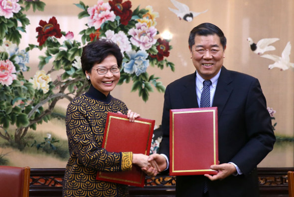 Carrie Lam Cheng Yuet-ngor, chief executive of the Hong Kong Special Administrative Region, shakes hands on Thursday in Beijing with He Lifeng, minister of the National Development and Reform Commission, after the signing of an agreement to advance Hong Kong's participation in the Belt and Road Initiative. [Photo: China Daily/Zou Hong) Carrie Lam Cheng Yuet-ngor, chief executive of the Hong Kong Special Administrative Region, shakes hands on Thursday in Beijing with He Lifeng, minister of the National Development and Reform Commission, after the signing of an agreement to advance Hong Kong's participation in the Belt and Road Initiative. [Photo: China Daily/Zou Hong)