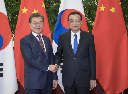 Chinese Premier Li Keqiang (R) meets with President of the Republic of Korea (ROK) Moon Jae-in in Beijing, capital of China, Dec. 15, 2017. (Xinhua/Li Tao) Chinese Premier Li Keqiang (R) meets with President of the Republic of Korea (ROK) Moon Jae-in in Beijing, capital of China, Dec. 15, 2017. (Xinhua/Li Tao)