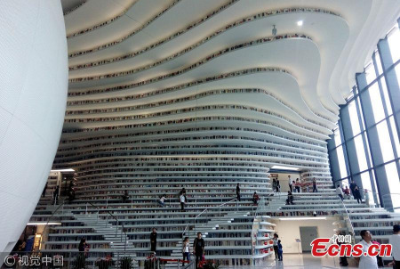 The Binhai New Area library, touted as the 'eye of Binhai', has become a new cultural landmark and tourist destination in Tianjin – the municipality neighboring Beijing. Inaugurated on the National Day earlier this month, the library rose to fame on Chinese social media this week as photos of its modern and magnificent design circulated widely online. The photos have been reposted and liked over 100,000 times on Sina Weibo, China's Twitter equivalent. (Photo/VCG) The Binhai New Area library, touted as the 'eye of Binhai', has become a new cultural landmark and tourist destination in Tianjin – the municipality neighboring Beijing. Inaugurated on the National Day earlier this month, the library rose to fame on Chinese social media this week as photos of its modern and magnificent design circulated widely online. The photos have been reposted and liked over 100,000 times on Sina Weibo, China's Twitter equivalent. (Photo/VCG)