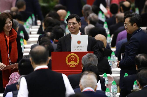 A voter casts his ballot during Hong Kong's 13th National People's Congress electoral council meeting on Tuesday. ROY LIU/CHINA DAILY A voter casts his ballot during Hong Kong's 13th National People's Congress electoral council meeting on Tuesday. ROY LIU/CHINA DAILY