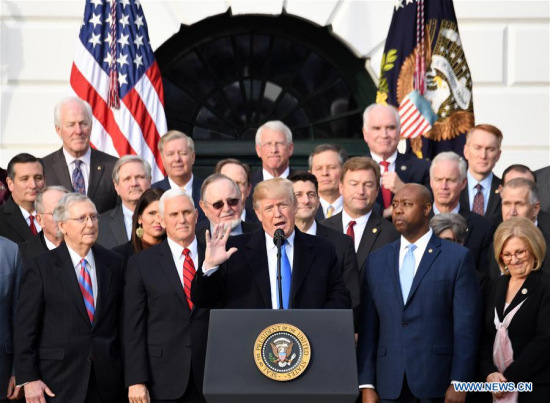 U.S. President Donald Trump (C) speaks at an event celebrating the passage of the tax bill on the South Lawn of the White House in Washington D.C., the United States, on Dec. 20, 2017. (Xinhua/Yin Bogu) U.S. President Donald Trump (C) speaks at an event celebrating the passage of the tax bill on the South Lawn of the White House in Washington D.C., the United States, on Dec. 20, 2017. (Xinhua/Yin Bogu)
