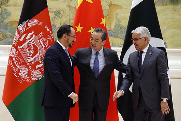 Foreign Minister Wang Yi is flanked by Afghan Foreign Minister Salahuddin Rabbani (left) and Pakistani Foreign Minister Khawaja Muhammad Asif in Beijing on Tuesday for the first China-Afghanistan-Pakistan Foreign Ministers' Dialogue. (Wang Zhuangfei/China Daily) Foreign Minister Wang Yi is flanked by Afghan Foreign Minister Salahuddin Rabbani (left) and Pakistani Foreign Minister Khawaja Muhammad Asif in Beijing on Tuesday for the first China-Afghanistan-Pakistan Foreign Ministers' Dialogue. (Wang Zhuangfei/China Daily)