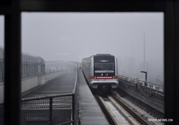 A train runs on Yanfang subway line in Beijing, capital of China, Dec. 30, 2017. Yanfang line started trial operation on Saturday. Located in Beijing's southwest suburbs, the Yanfang Line is China's first fully domestically developed automated subway. It has nine stations on its 14.4-km main line, linking the areas of Yanshan and Fangshan. The line is expected to carry 70,000 passengers daily. (Xinhua/Luo Xiaoguang) A train runs on Yanfang subway line in Beijing, capital of China, Dec. 30, 2017. Yanfang line started trial operation on Saturday. Located in Beijing's southwest suburbs, the Yanfang Line is China's first fully domestically developed automated subway. It has nine stations on its 14.4-km main line, linking the areas of Yanshan and Fangshan. The line is expected to carry 70,000 passengers daily. (Xinhua/Luo Xiaoguang)