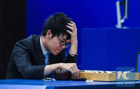 Chinese Go player Ke Jie analyses the game after the second match against artificial intelligence program AlphaGo in Wuzhen, east China's Zhejiang province, May 25, 2017.(Xinhua/Xu Yu) Chinese Go player Ke Jie analyses the game after the second match against artificial intelligence program AlphaGo in Wuzhen, east China's Zhejiang province, May 25, 2017.(Xinhua/Xu Yu)