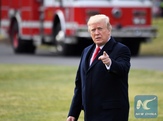 File Photo: U.S. President Donald Trump gestures as he leaves the White House en route to Mar-a-lago Estate in Florida after signing the tax cut bill into law in Washington D.C., the United States, on Dec. 22, 2017. (Xinhua/Yin Bogu) File Photo: U.S. President Donald Trump gestures as he leaves the White House en route to Mar-a-lago Estate in Florida after signing the tax cut bill into law in Washington D.C., the United States, on Dec. 22, 2017. (Xinhua/Yin Bogu)