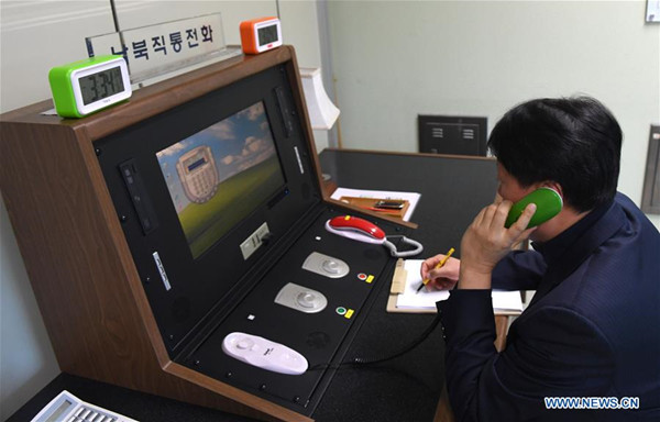 A South Korean government official communicates with the Democratic People's Republic of Korea (DPRK) side via the communication channel in Panmunjom, South Korea, on Jan. 3, 2018. (Xinhua/Ministry of Unification of the Republic of Korea) A South Korean government official communicates with the Democratic People's Republic of Korea (DPRK) side via the communication channel in Panmunjom, South Korea, on Jan. 3, 2018. (Xinhua/Ministry of Unification of the Republic of Korea)