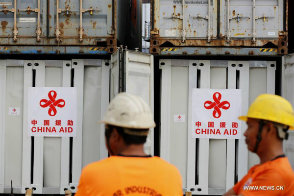 Containers carrying prefabricated houses are seen at the Myanmar Industrial Port in Yangon, on Jan. 6, 2018. China on Saturday handed over to Myanmar authorities about 100 prefabricated houses for displaced persons in Myanmar's western Rakhine state at the Myanmar Industrial Port. (Xinhua/U Aung) Containers carrying prefabricated houses are seen at the Myanmar Industrial Port in Yangon, on Jan. 6, 2018. China on Saturday handed over to Myanmar authorities about 100 prefabricated houses for displaced persons in Myanmar's western Rakhine state at the Myanmar Industrial Port. (Xinhua/U Aung)