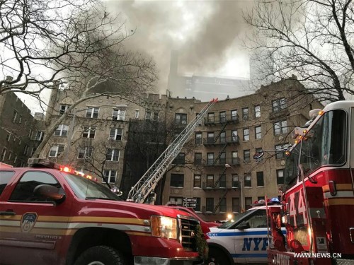 Vehicles of Fire Department of New York (FDNY) gather at the site where a fire broke out in Manhattan, New York, the United States, on Jan. 8, 2018. Fourteen people were injured in a fire at an apartment building in Manhattan in New York City on Monday afternoon, according to the New York Fire Department. (Xinhua/Wang Ying) Vehicles of Fire Department of New York (FDNY) gather at the site where a fire broke out in Manhattan, New York, the United States, on Jan. 8, 2018. Fourteen people were injured in a fire at an apartment building in Manhattan in New York City on Monday afternoon, according to the New York Fire Department. (Xinhua/Wang Ying)