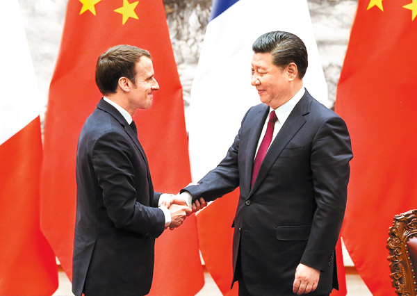 President Xi Jinping shakes hands with French President Emmanuel Macron after meeting the press at the Great Hall of the People on Tuesday in Beijing. (Photo:China Daily/Feng Yongbin) President Xi Jinping shakes hands with French President Emmanuel Macron after meeting the press at the Great Hall of the People on Tuesday in Beijing. (Photo:China Daily/Feng Yongbin)