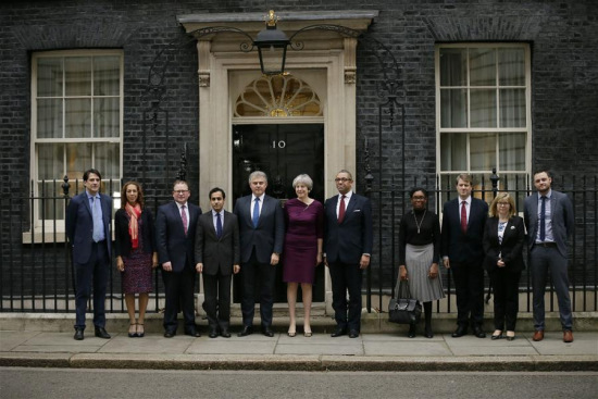 British Prime Minister Theresa May (C) poses for a picture outside 10 Downing street with Conservative Party Chairman Brandon Lewis (5th L) and Conservative Party Deputy Chairman James Cleverly (5th R), with Conservative vice chair members as she announces new ministerial appointments to her front bench in a Cabinet reshuffle beginning today, in London, Britain on Jan. 8, 2018. (Xinhua/Tim Ireland) British Prime Minister Theresa May (C) poses for a picture outside 10 Downing street with Conservative Party Chairman Brandon Lewis (5th L) and Conservative Party Deputy Chairman James Cleverly (5th R), with Conservative vice chair members as she announces new ministerial appointments to her front bench in a Cabinet reshuffle beginning today, in London, Britain on Jan. 8, 2018. (Xinhua/Tim Ireland)