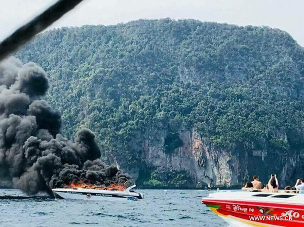 The photo taken by a mobile phone on Jan. 14, 2018 shows a speedboat explosion on southern Thailand's Andaman Sea near Phi-Phi Islands. A speedboat carrying 27 Chinese tourists and several Thai crews exploded on southern Thailand's Andaman Sea near Phi-Phi Islands on Sunday. (Xinhua) The photo taken by a mobile phone on Jan. 14, 2018 shows a speedboat explosion on southern Thailand's Andaman Sea near Phi-Phi Islands. A speedboat carrying 27 Chinese tourists and several Thai crews exploded on southern Thailand's Andaman Sea near Phi-Phi Islands on Sunday. (Xinhua)