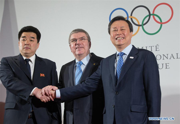 International Olympic Committee (IOC) President Thomas Bach (C) shakes hands with Kim Il Guk (L), the president of the Olympic Committee of the Democratic People's Republic of Korea (DPRK) and Do Jong-hwan (R), minister of Culture, Sports and Tourism of South Korea in Lausanne, Switzerland, on Jan. 20, 2018. (Xinhua/Xu Jinquan) International Olympic Committee (IOC) President Thomas Bach (C) shakes hands with Kim Il Guk (L), the president of the Olympic Committee of the Democratic People's Republic of Korea (DPRK) and Do Jong-hwan (R), minister of Culture, Sports and Tourism of South Korea in Lausanne, Switzerland, on Jan. 20, 2018. (Xinhua/Xu Jinquan)