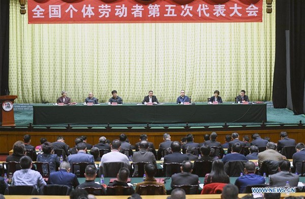 The fifth national congress of self-employed individuals kicks off in Beijing, capital of China, Jan. 22, 2018. State Councilor Wang Yong read Chinese President Xi Jinping's congratulatory letter to the meeting and Chinese Premier Li Keqiang's written instruction, and delivered a speech at the meeting. (Xinhua/Zhang Ling) The fifth national congress of self-employed individuals kicks off in Beijing, capital of China, Jan. 22, 2018. State Councilor Wang Yong read Chinese President Xi Jinping's congratulatory letter to the meeting and Chinese Premier Li Keqiang's written instruction, and delivered a speech at the meeting. (Xinhua/Zhang Ling)