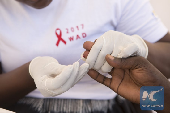 A person receives a free HIV test during the World AIDS Day activities in Kigali, Rwanda, on Dec. 1, 2017. (Xinhua/Gabriel Dusabe) A person receives a free HIV test during the World AIDS Day activities in Kigali, Rwanda, on Dec. 1, 2017. (Xinhua/Gabriel Dusabe)