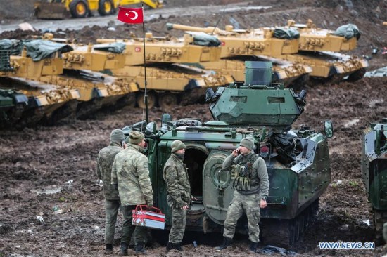 Turkish soldiers are seen with their armored vehicles near Turkish-Syrian border in Hatay, Turkey, on Jan. 23, 2018. (Xinhua) Turkish soldiers are seen with their armored vehicles near Turkish-Syrian border in Hatay, Turkey, on Jan. 23, 2018. (Xinhua)