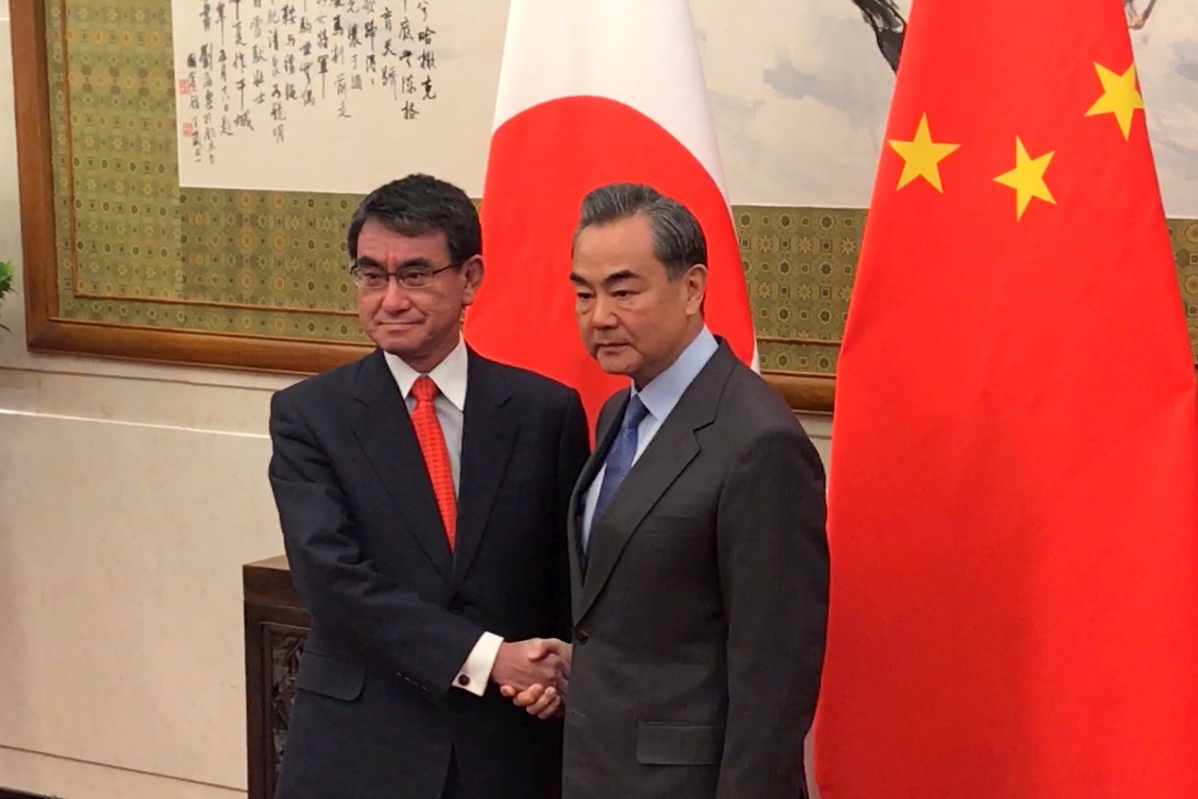 Foreign Minister Wang Yi meets with his visiting Japanese counterpart Taro Kono at Diaoyutai State Guesthouse Sunday morning in Beijing. (Zhang Yunbi/For chinadaily.com.cn) Foreign Minister Wang Yi meets with his visiting Japanese counterpart Taro Kono at Diaoyutai State Guesthouse Sunday morning in Beijing. (Zhang Yunbi/For chinadaily.com.cn)