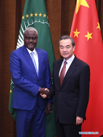 Chinese Foreign Minister Wang Yi (R) shakes hands with Chairperson of theAfrican Union(AU) Commission Moussa Faki Mahamat at the 7th China-AU strategic dialogue in Beijing, capital of China, Feb. 8, 2018. (Xinhua/Yan Yan) Chinese Foreign Minister Wang Yi (R) shakes hands with Chairperson of theAfrican Union(AU) Commission Moussa Faki Mahamat at the 7th China-AU strategic dialogue in Beijing, capital of China, Feb. 8, 2018. (Xinhua/Yan Yan)
