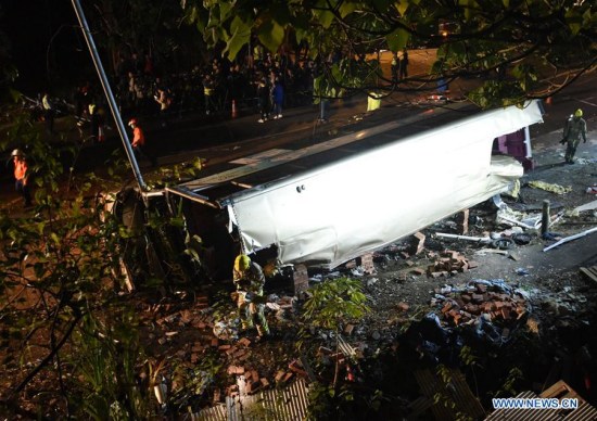 Rescuers work at the accident site where a double-decker bus overturned in New Territories in Hong Kong Special Administrative Region, south China, Feb. 10, 2018. (Xinhua/Wang Shen)