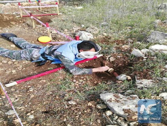 A Chinese peacekeeper in the UNIFIL discovered a mine buried underground along the UN Blue Line between Israel and Lebanon, on Feb. 5, 2018. (Xinhua) A Chinese peacekeeper in the UNIFIL discovered a mine buried underground along the UN Blue Line between Israel and Lebanon, on Feb. 5, 2018. (Xinhua)