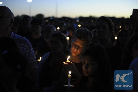 People hold candles during a vigil for the victims of the shooting at Marjory Stoneman Douglas High School, in Parkland, Florida, the United States, Feb. 15, 2018. (Xinhua/Liu Yang) People hold candles during a vigil for the victims of the shooting at Marjory Stoneman Douglas High School, in Parkland, Florida, the United States, Feb. 15, 2018. (Xinhua/Liu Yang)