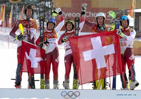 Team Switzerland celebrate after winning the team event final of alpine skiing at the 2018 PyeongChang Winter Olympic Games at Yongpyong Alpine Centre, PyeongChang, South Korea, Feb. 24, 2018. Team Switzerland beat Team Austria 3:1 and won the gold medal in the big final. (Xinhua/Bai Xuefei) Team Switzerland celebrate after winning the team event final of alpine skiing at the 2018 PyeongChang Winter Olympic Games at Yongpyong Alpine Centre, PyeongChang, South Korea, Feb. 24, 2018. Team Switzerland beat Team Austria 3:1 and won the gold medal in the big final. (Xinhua/Bai Xuefei)