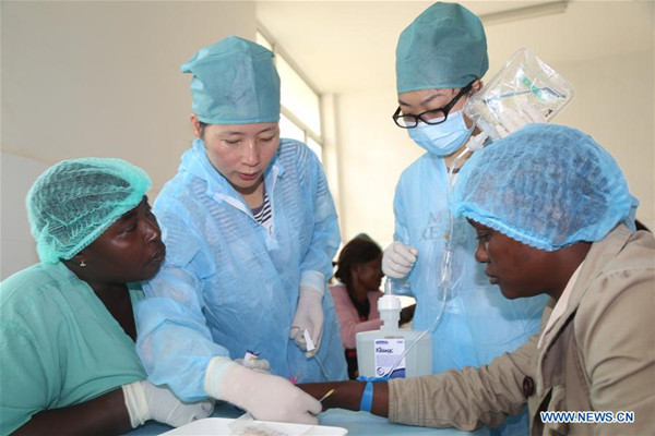 Medical members receive training from a medical team of China's People's Liberation Army (PLA), to fight against Ebola disease at a hospital in Freetown, capital of Sierra Leone, Dec. 10, 2014. (Xinhua/Dai Xin) Medical members receive training from a medical team of China's People's Liberation Army (PLA), to fight against Ebola disease at a hospital in Freetown, capital of Sierra Leone, Dec. 10, 2014. (Xinhua/Dai Xin)