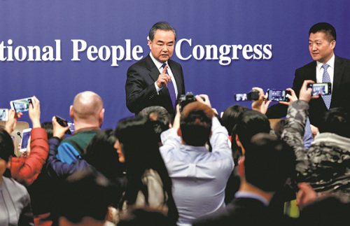Foreign Minister Wang Yi takes questions from reporters on Thursday at a news conference on the sidelines of the annual session of the National People's Congress in Beijing. (Photo/China Daily) Foreign Minister Wang Yi takes questions from reporters on Thursday at a news conference on the sidelines of the annual session of the National People's Congress in Beijing. (Photo/China Daily)