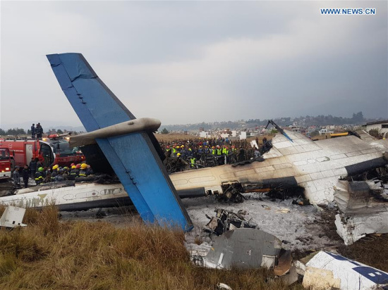 Photo taken on March 12, 2018 shows the crash-landing site in Kathmandu, Nepal. A passenger plane of the US-Bangla Airlines crashed at Nepal's Tribhuvan International Airport (TIA) on Monday, with dozens feared dead and at least 17 people injured. (Xinhua) Photo taken on March 12, 2018 shows the crash-landing site in Kathmandu, Nepal. A passenger plane of the US-Bangla Airlines crashed at Nepal's Tribhuvan International Airport (TIA) on Monday, with dozens feared dead and at least 17 people injured. (Xinhua)